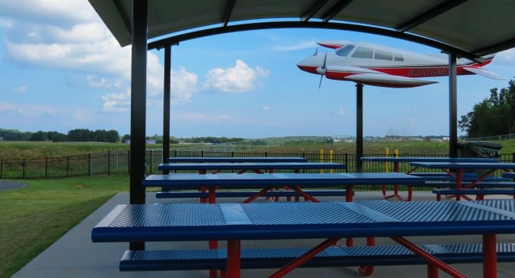 Tables under a pavilion at the Greenville Airport park