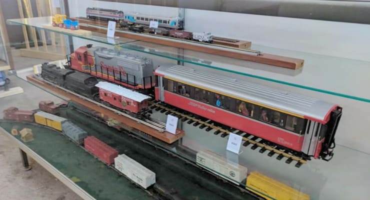 Model trains on glass shelves