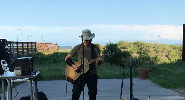 A man playing a live music show near the beach at Isle of Palms.