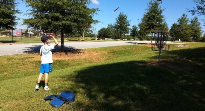 Playing disc golf