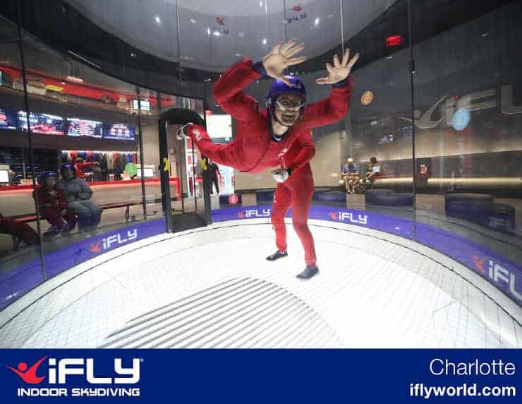 Man experiencing indoor skydiving at iFly.