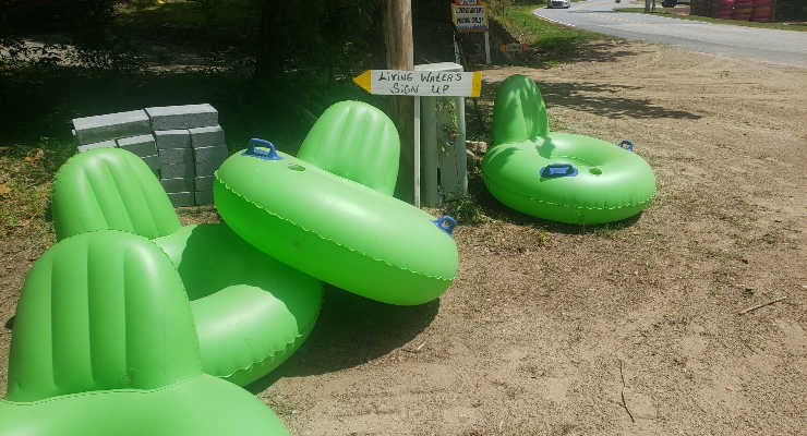 Lime green water tubes for riding down the river.