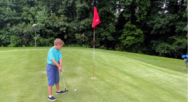 little kid on 3's Greenville golf course