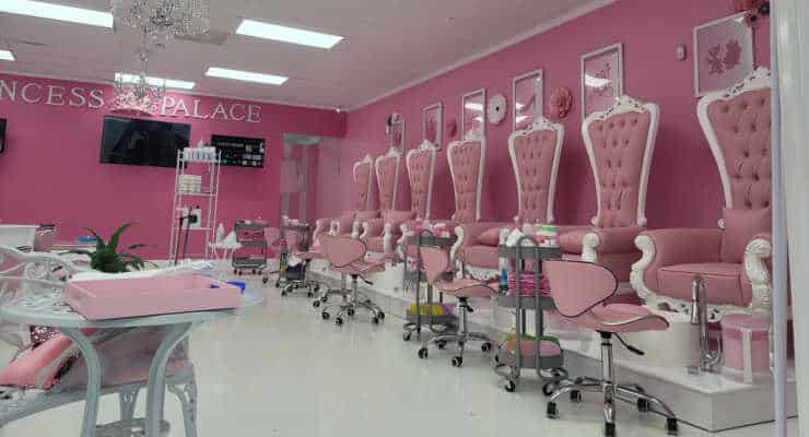 Interior of a pink and white nail salon.