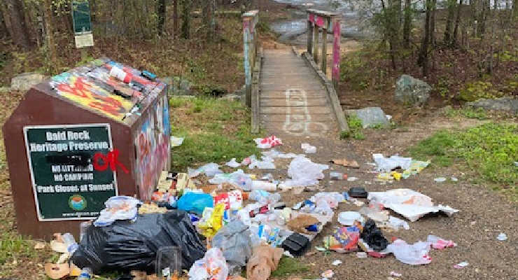 Trash litters the entrance to Bald Rock Heritage Preserve 