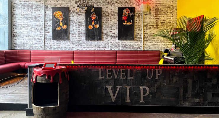 VIP lounge with red seating at Pinky's Revenge
