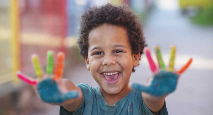 happy child with painted hands