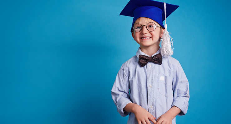boy with graduation cap with blue background