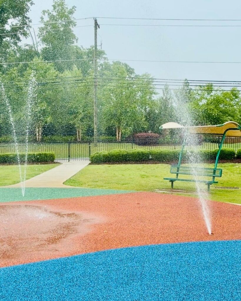 Benches for parents at the splash pad at the McKinney Park playground in Woodruff, SC