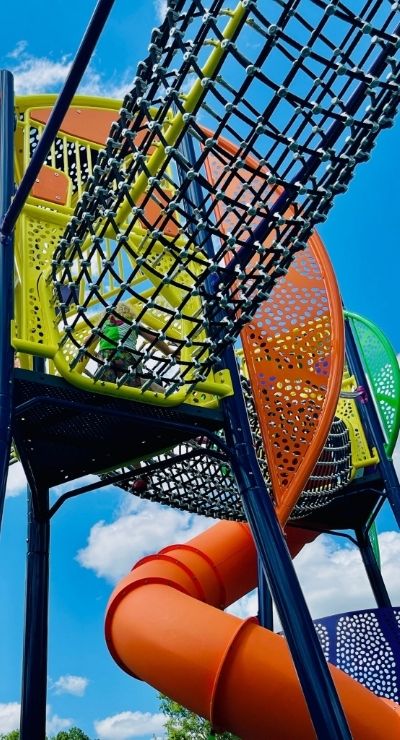 Image of a ropes course at the top of the new playground equipment.