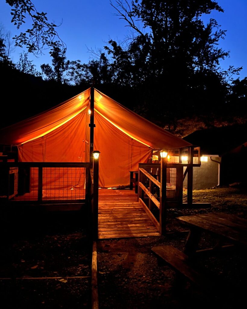 The glamping tent at night at Wilderness Cove