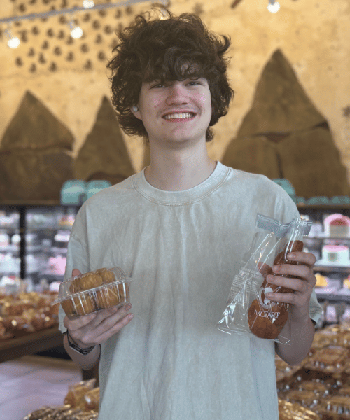 Holding bakery items at Mozart Bakery in Duluth, Georgia