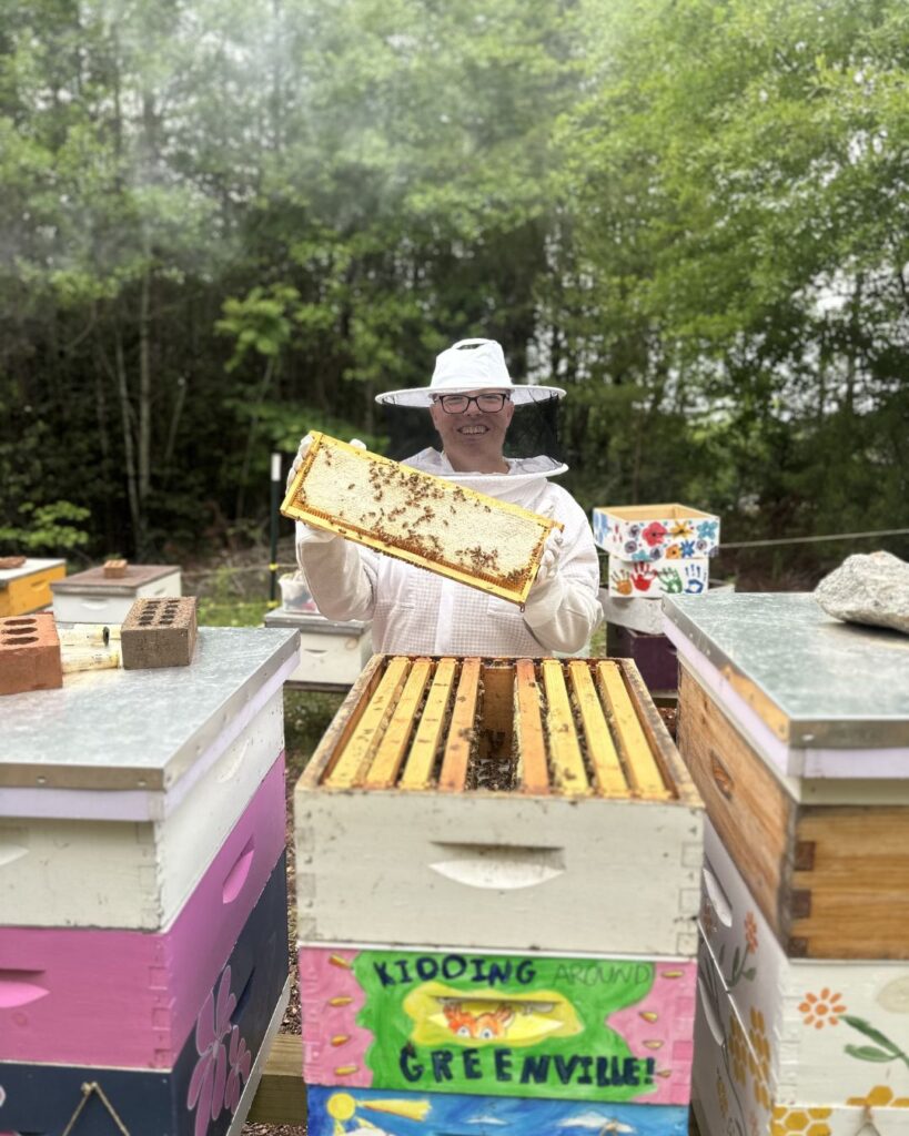Holding the Kidding Around bees at Happy Hive Bee Co