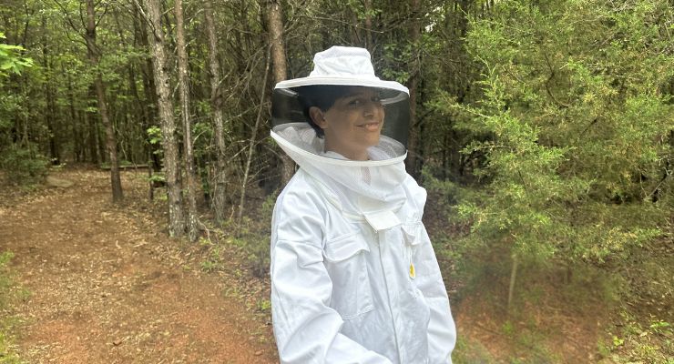 In a bee suit at Happy Hive