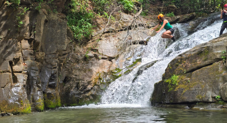 jumping into the swimming hole