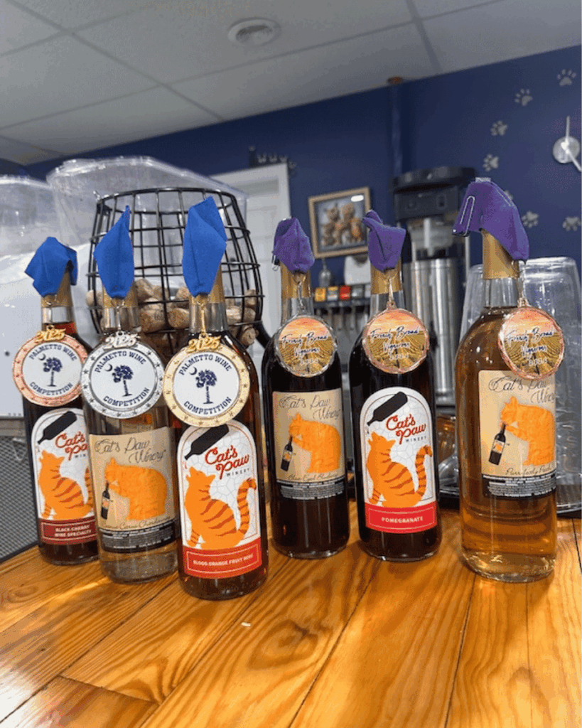 Bottles of wine with the Cat's Paw Winery logo