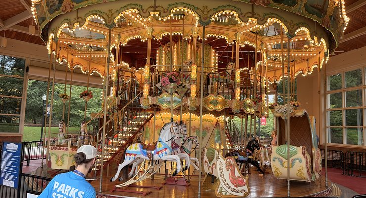 children riding the historic carousel at Village Park in Kannapolis NC