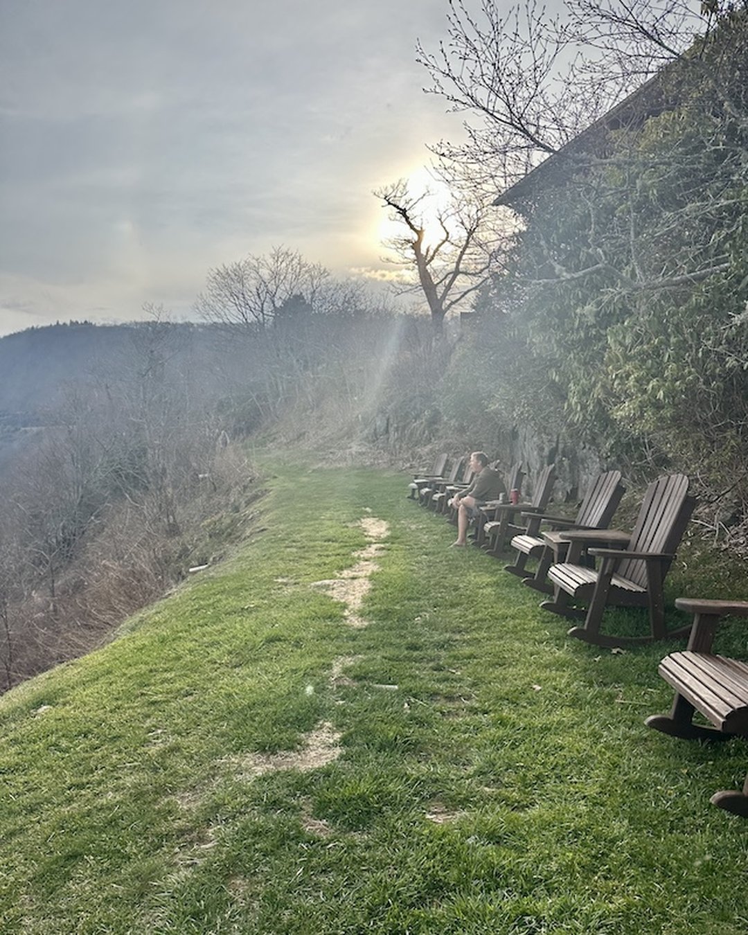 Back of Pisgah Inn property with Blue Ridge mountain views and rocking chairs