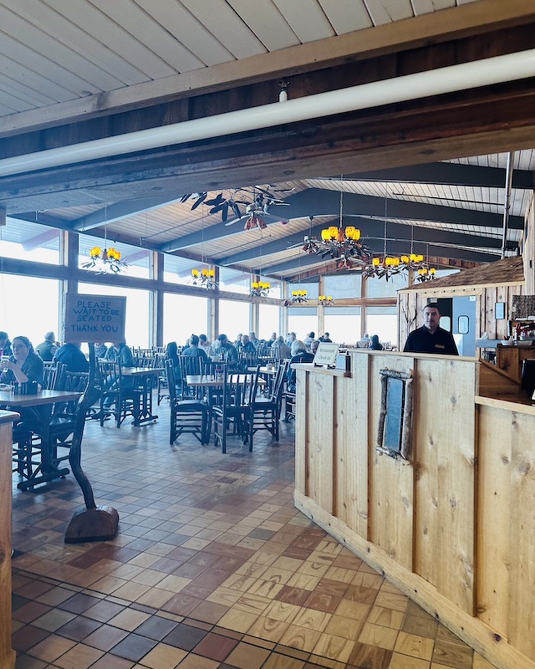 Pisgah Inn restaurant interior with mountain views through large windows