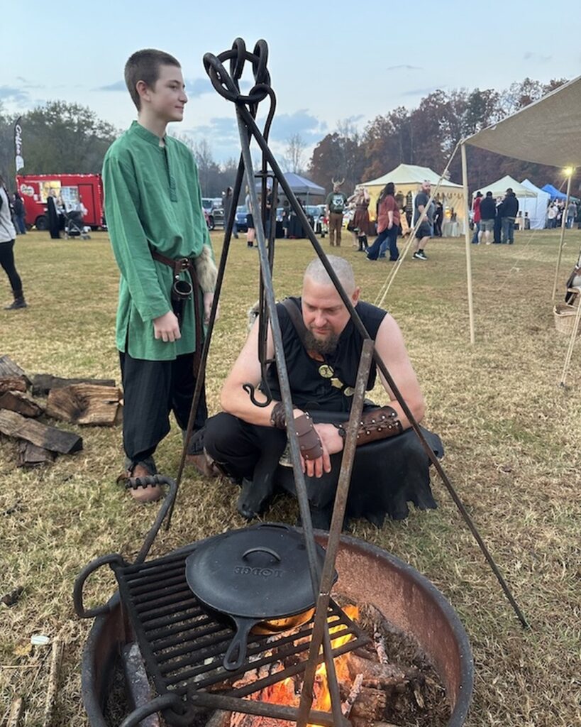 Viking reenactors in costume at Midgard at the Mill festival in Pickens, SC