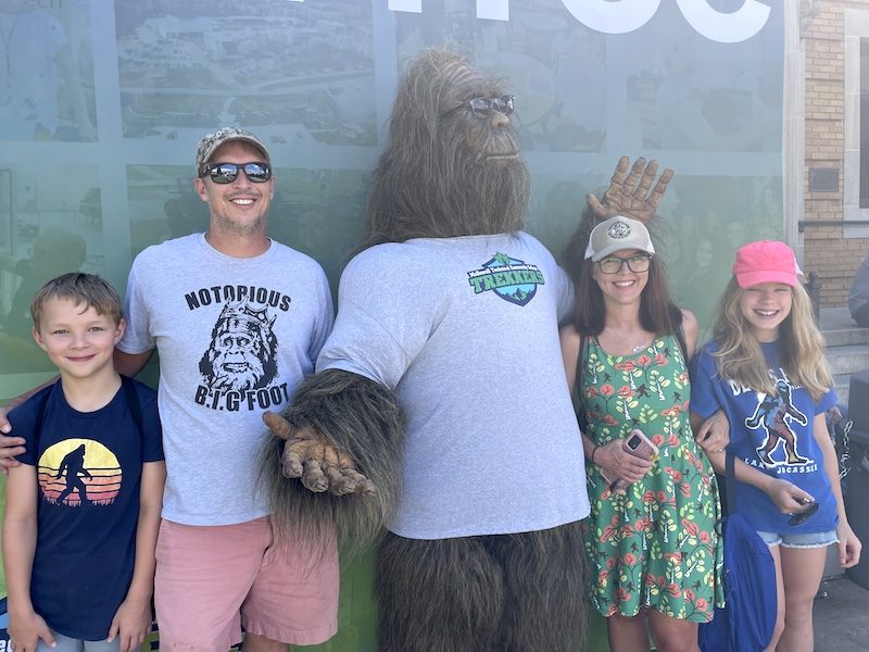 Family wearing Bigfoot-themed shirts at the WNC Bigfoot Festival in Marion, NC